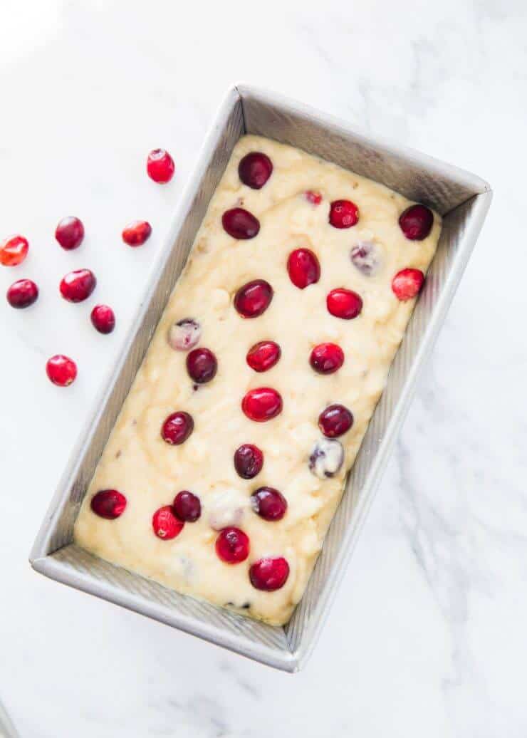 cranberry banana bread in loaf pan ready to bake