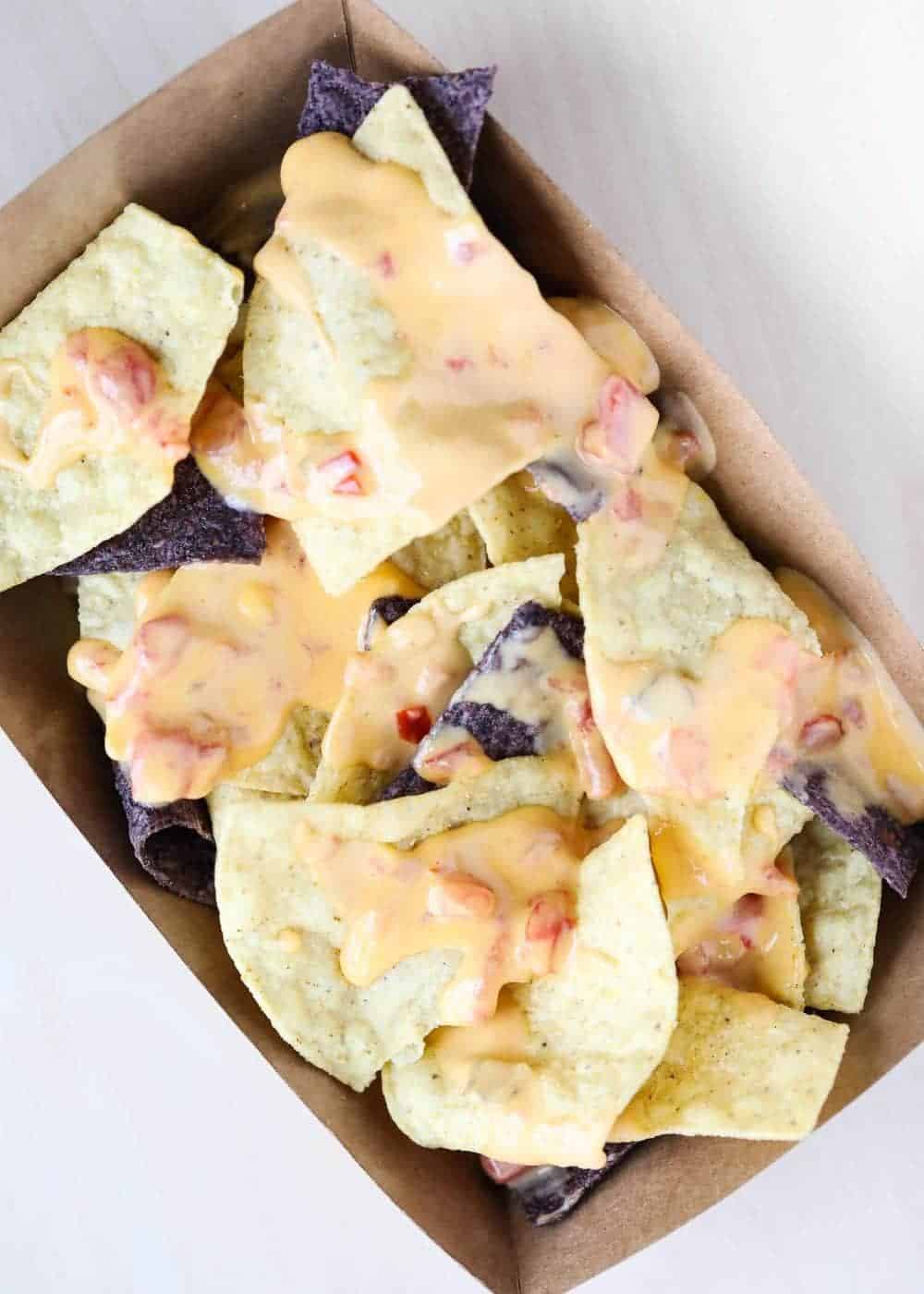 nachos with famous queso cheese on top 