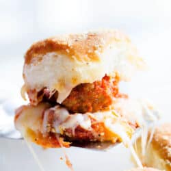 cheesy meatball slider on a spatula