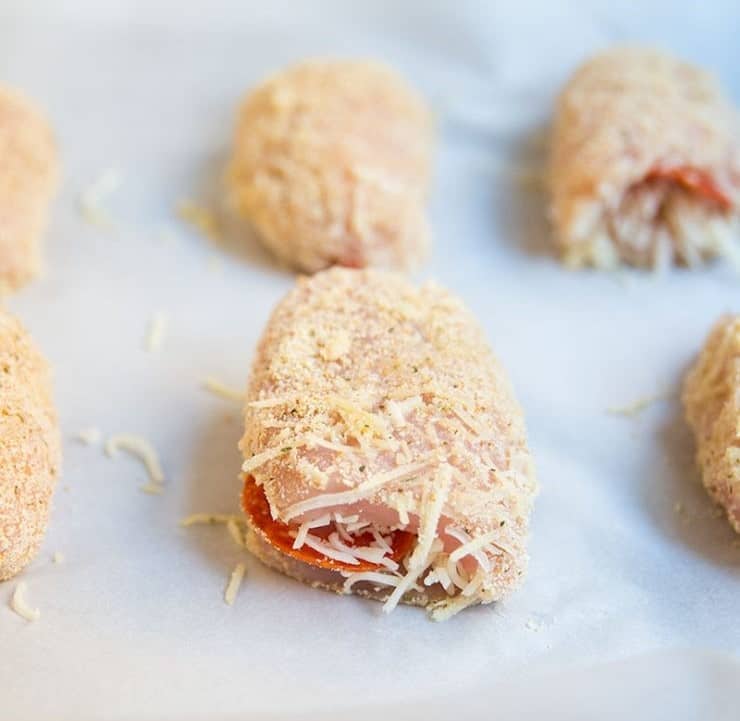Pizza stuffed chicken with a breadcrumb coating.