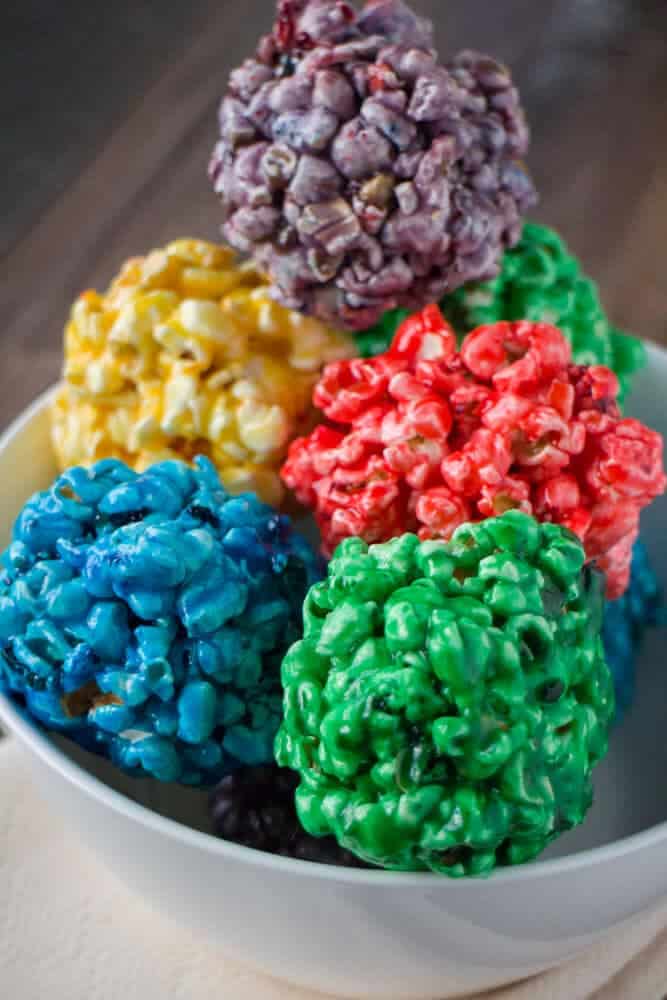 Rainbow popcorn balls + Top 50 Rainbow Desserts - the perfect way to celebrate St. Patrick's Day and welcome spring!