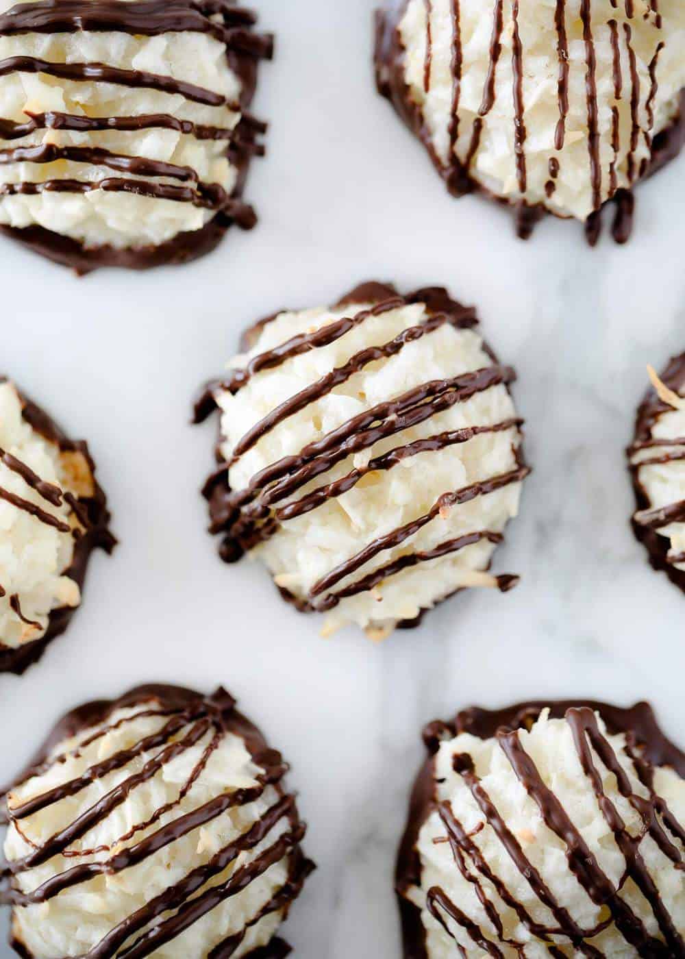 Macaroon cookies drizzled in chocolate.