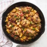 dijon chicken and potatoes in a cast iron skillet