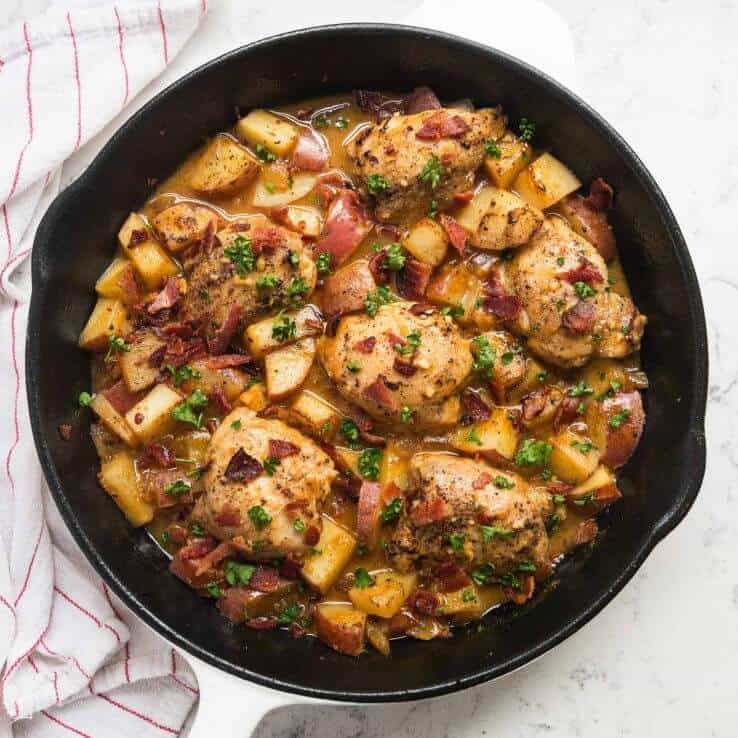 dijon chicken and potatoes in cast iron skillet 