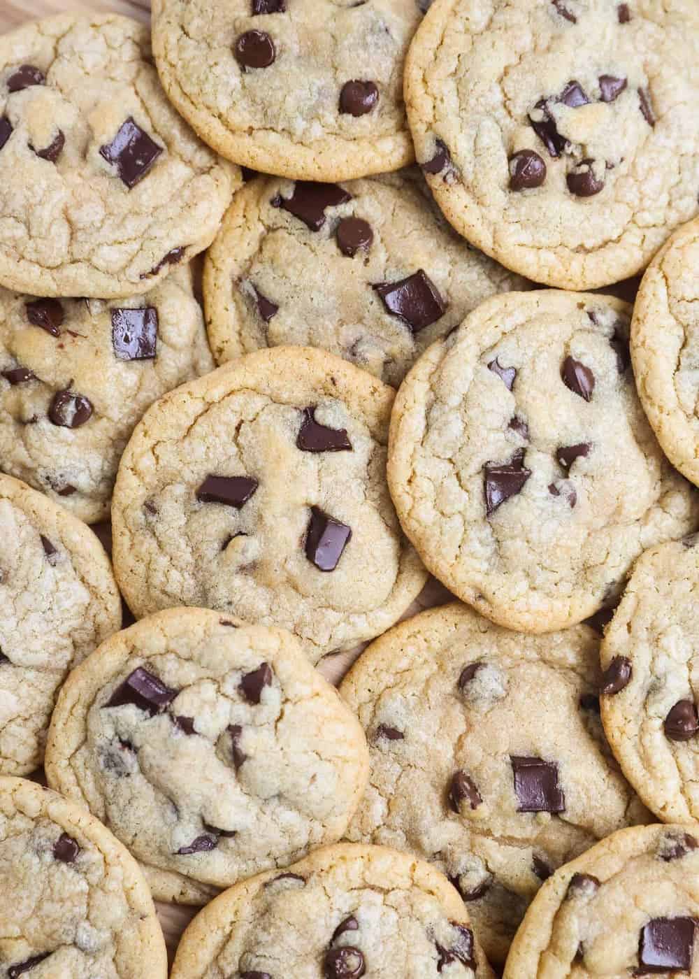 Baked chocolate chip cookies stacked on top of each other. 