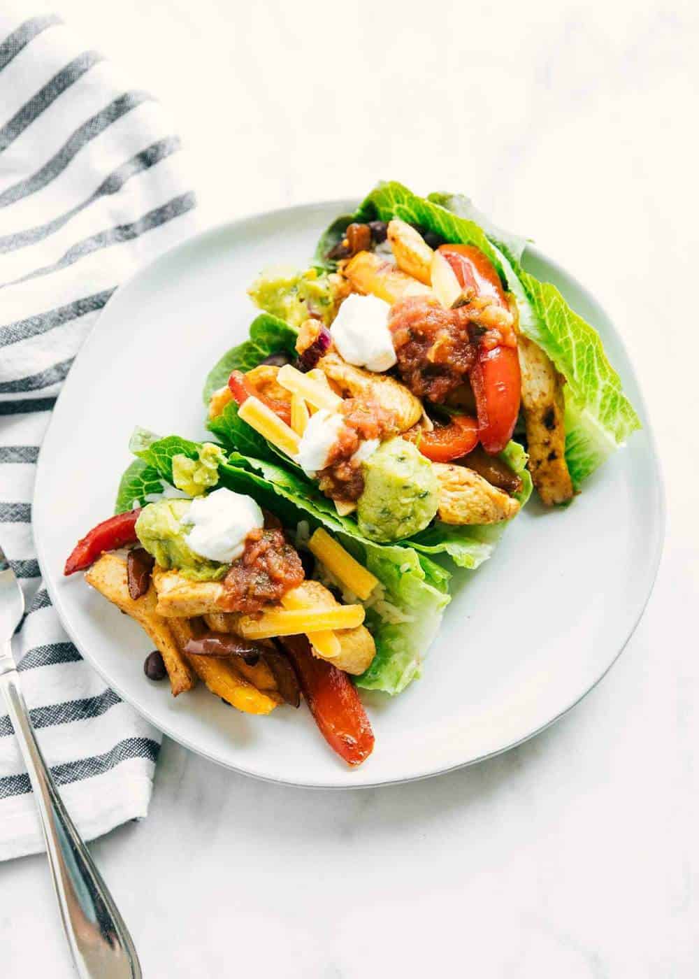 Chicken fajitas over romaine lettuce wraps.