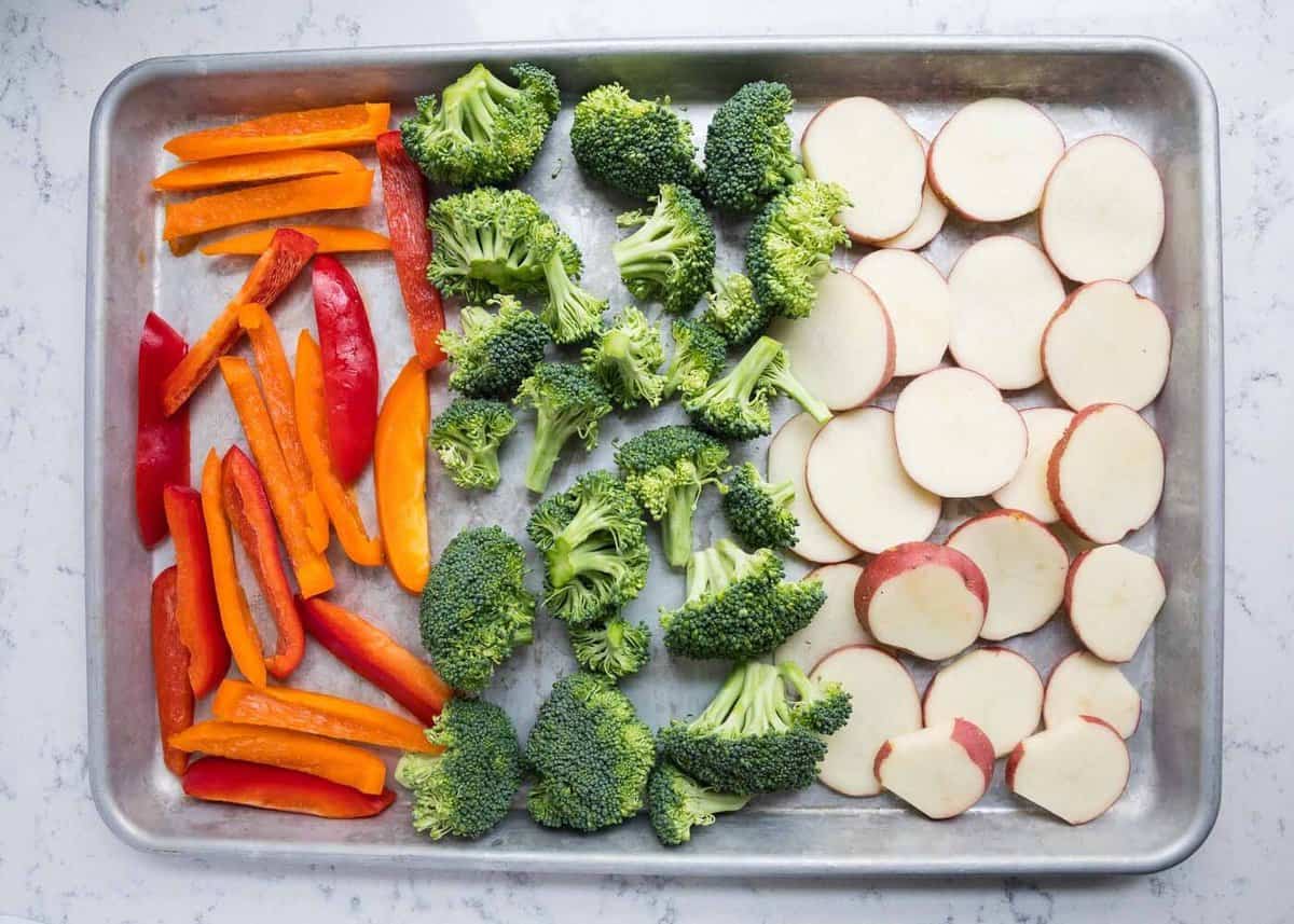 Raw veggies on a baking sheet.