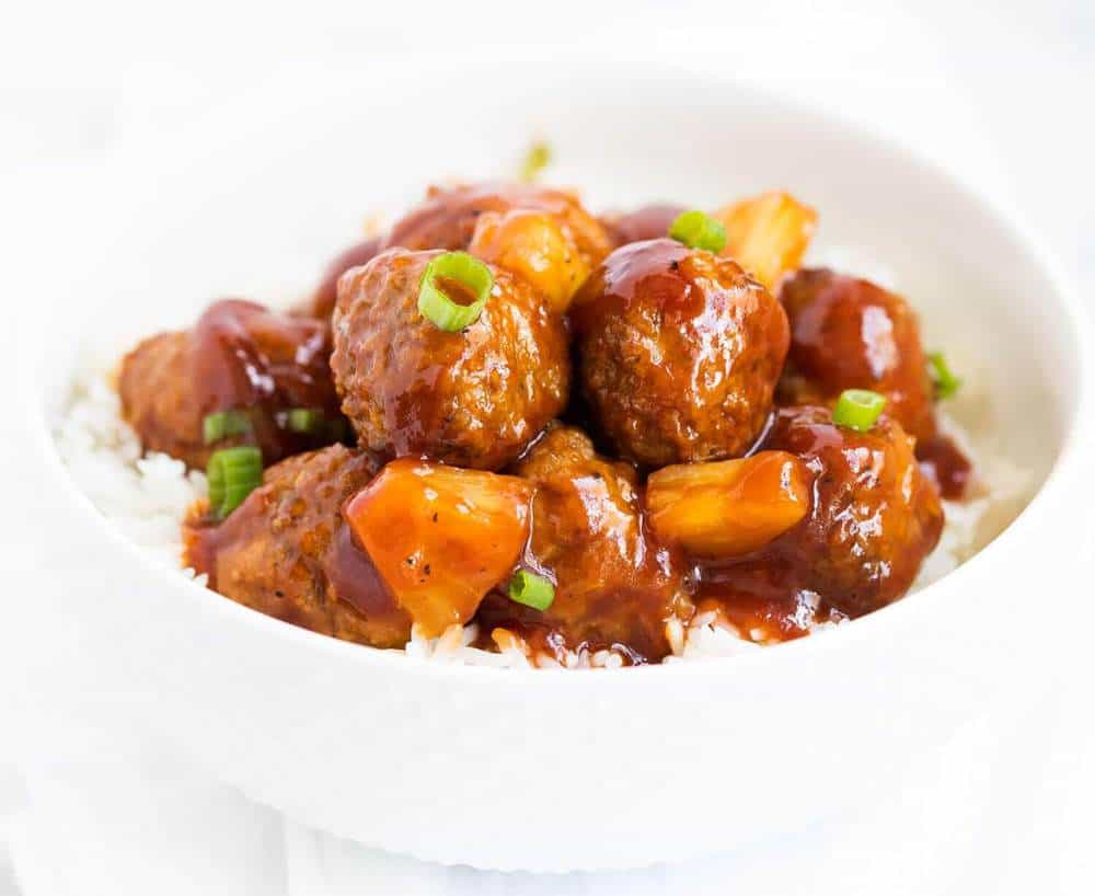 Sweet and sour meatballs in a white dish. 