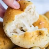 pulling a garlic cheese roll apart