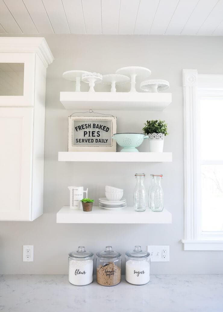 Modern farmhouse kitchen makeover with amazing before and after photos -white floating shelves