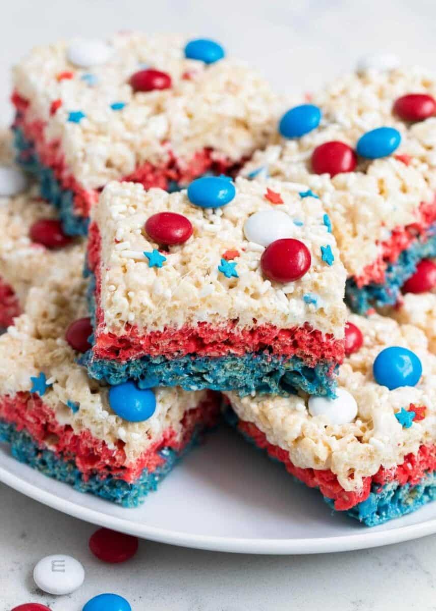 4th of july rice krispie treats stacked on a white plate 