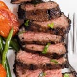 sliced grilled steak on a plate