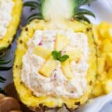 pineapple fluff served in a fresh pineapple boat