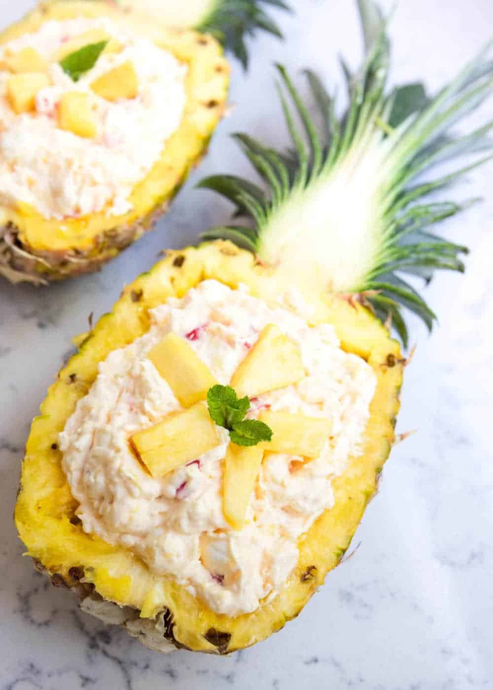 pineapple fluff recipe in a fresh pineapple boat 