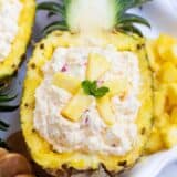 pineapple fluff served in a pineapple boat
