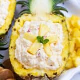pineapple fluff served in a pineapple boat