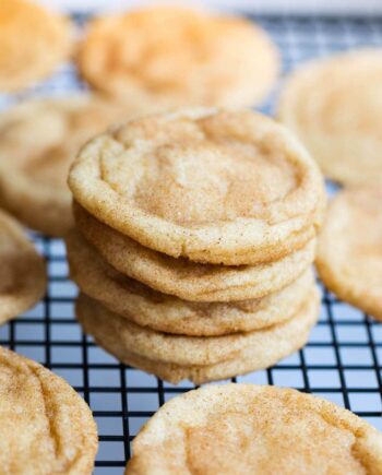 stack of snickerdoodles on a cooling rack