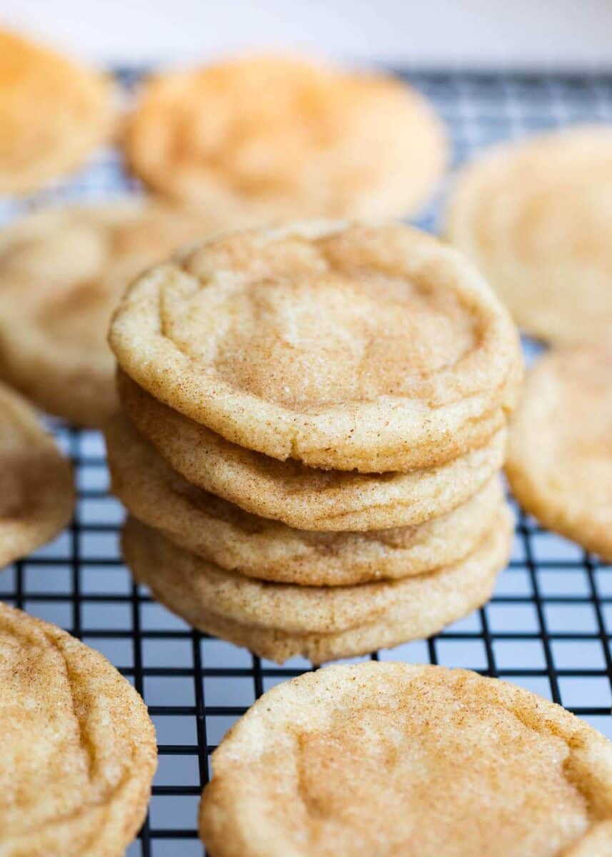 stack of snickerdoodles on a cooling rack 