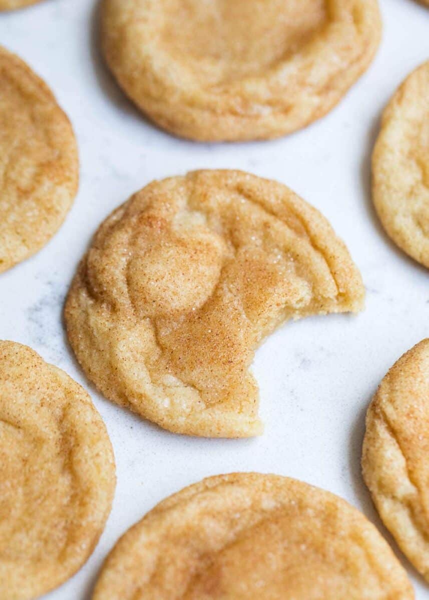homemade snickerdoodles with a bite taken out 