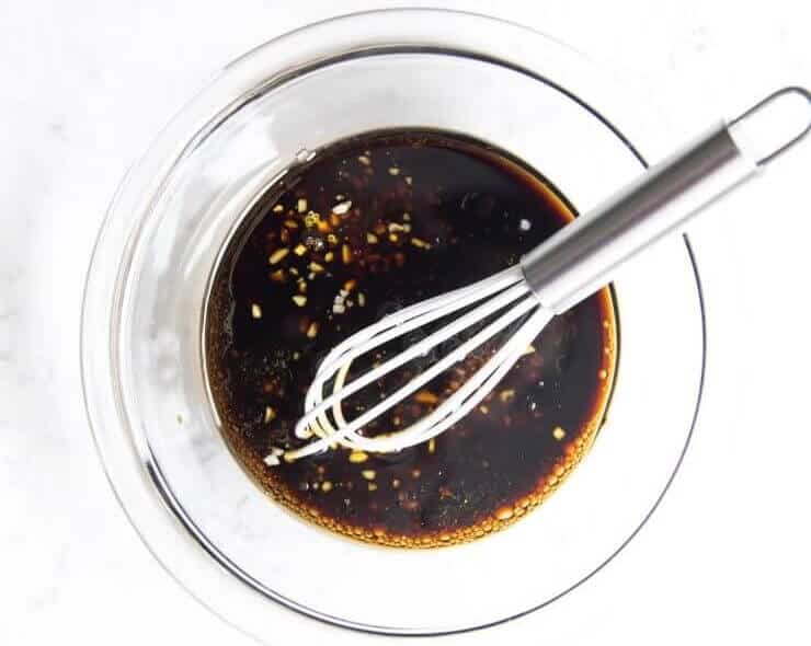 This easy steak marinade takes only 5 ingredients and 5 minutes of prep! The most delicious flavor that creates a tender and juicy steak. whisking together steak marinade in a bowl