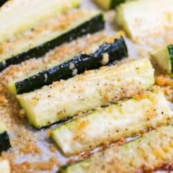 A close up of baked parmesan zucchini fries