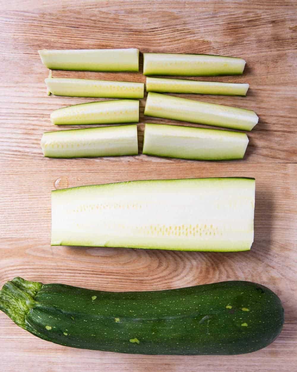 sliced zucchini on a cutting board 