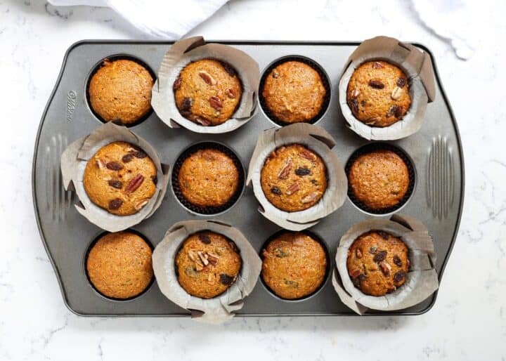 baked morning glory muffins in muffin pan 
