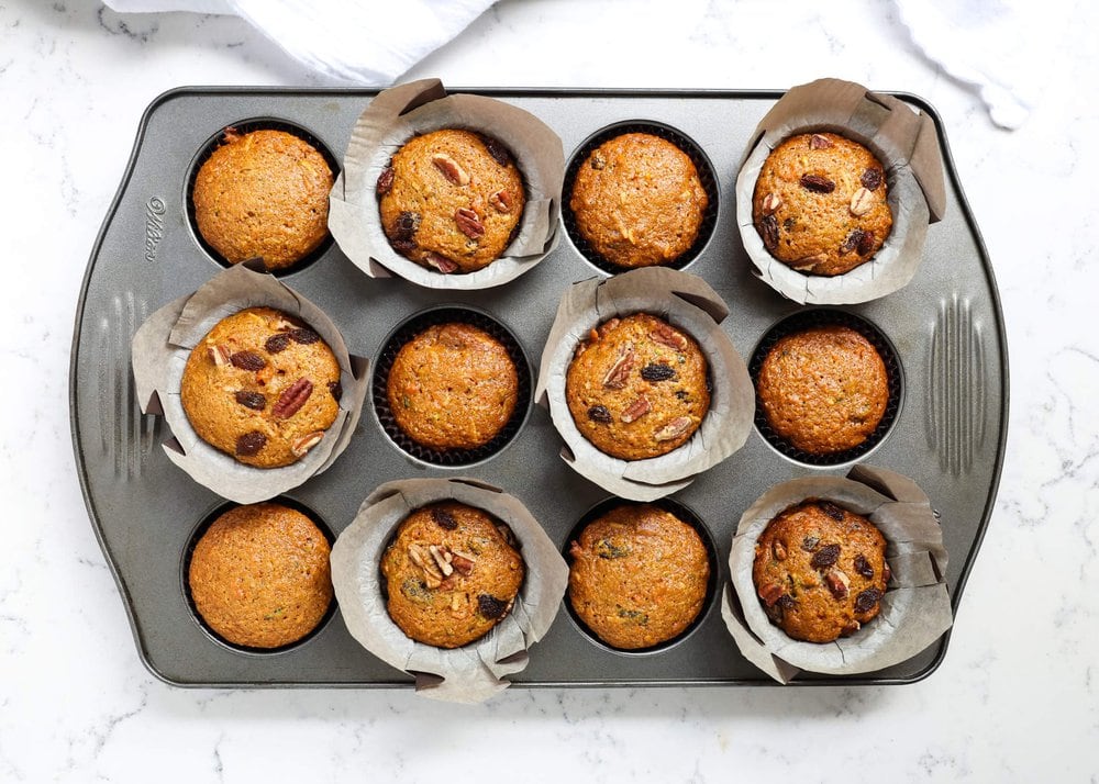 Morning glory muffins in a muffin tin. 