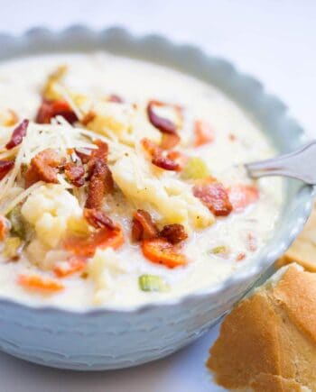 A close up of a bowl of roasted cauliflower soup