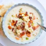 roasted cauliflower soup in a blue bowl