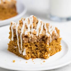 A piece of pumpkin coffee cake on a white plate