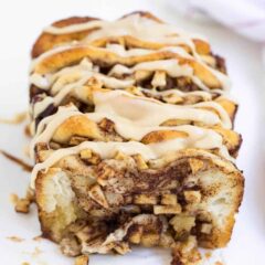 loaf of apple pull apart bread drizzled with caramel icing