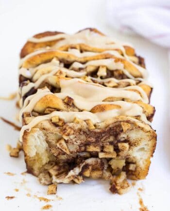 loaf of apple pull apart bread drizzled with caramel icing