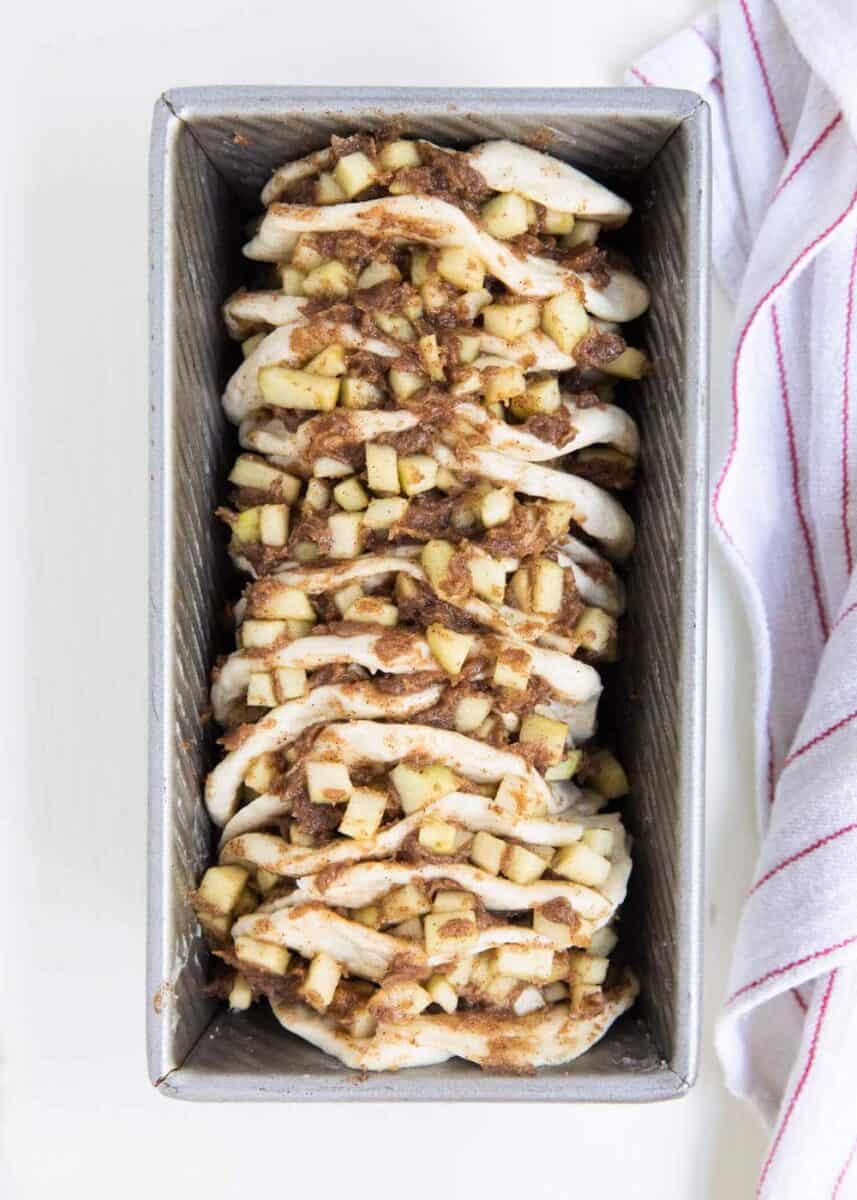 unbaked pull apart apple bread in loaf pan 