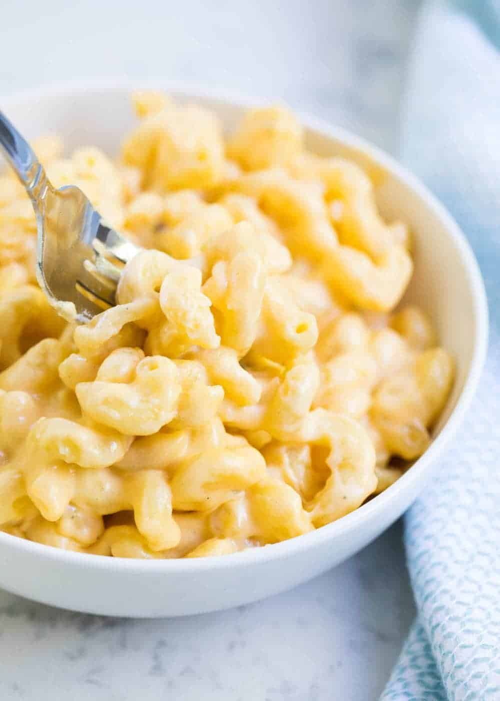 Bowl of mac and cheese with a fork.