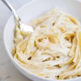 bowl of alfredo with a fork