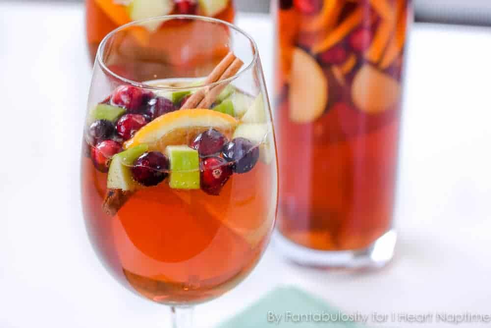 A glass of sangria with fresh fruit. 