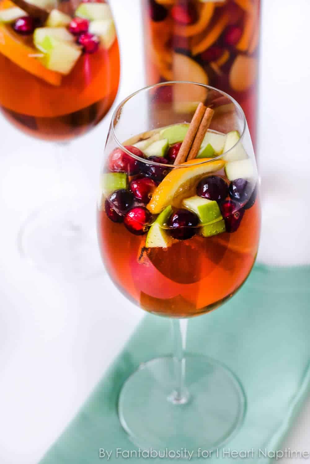 Wine glass filled with holiday sangria.