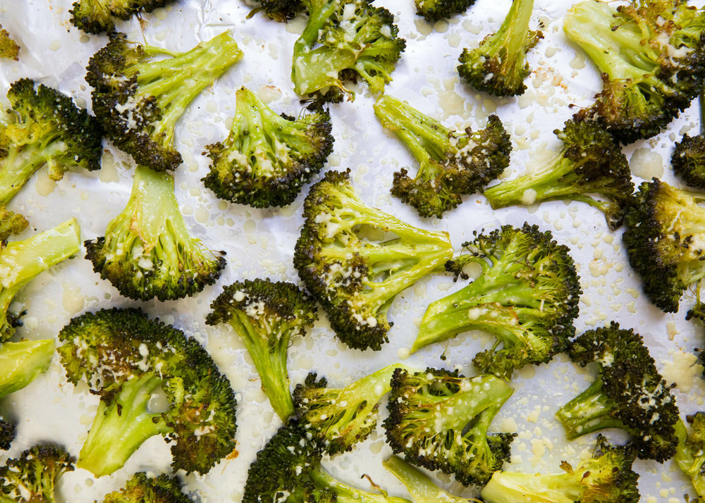 roasted parmesan broccoli on a baking sheet 