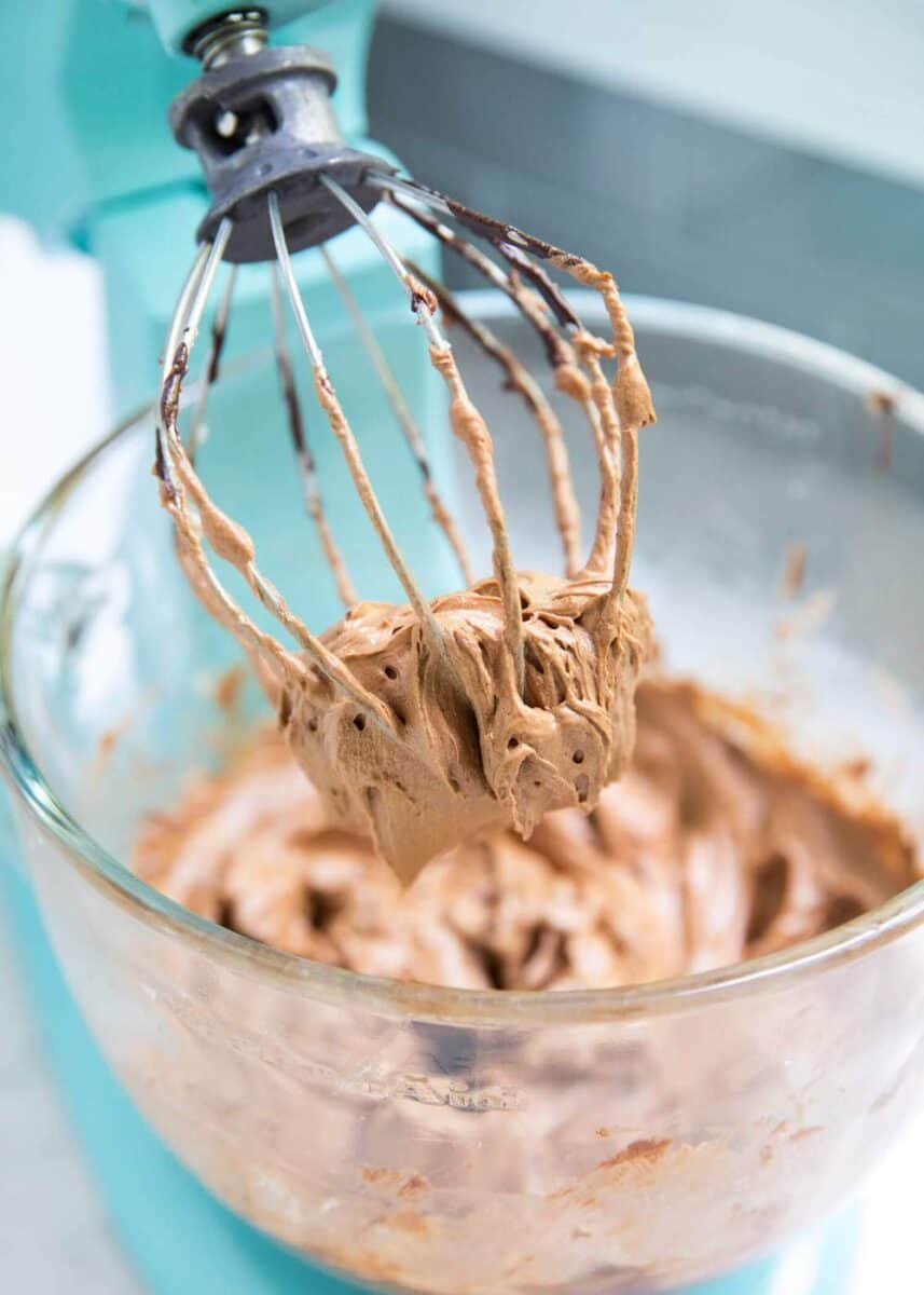 beating chocolate filling in an electric mixer 