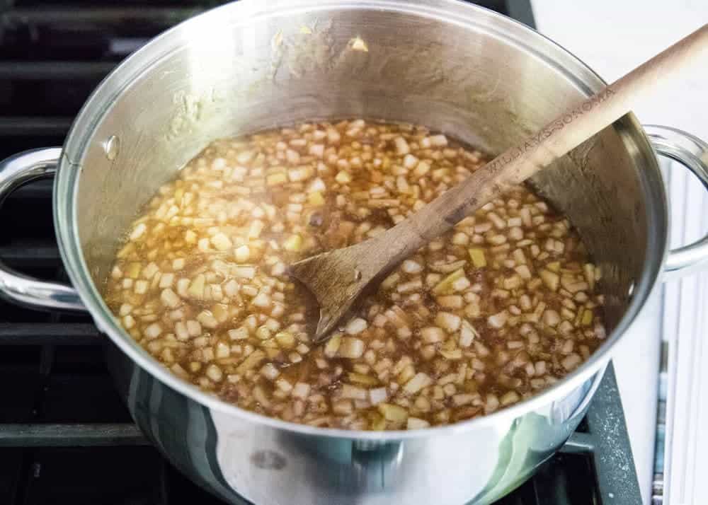 cooking apple pie filling in pan on stove