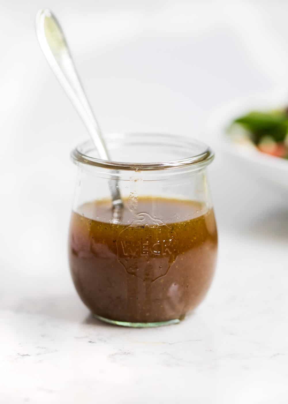 Honey dijon dressing in a glass jar. 