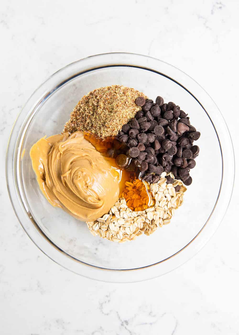 protein ball ingredients in glass bowl 
