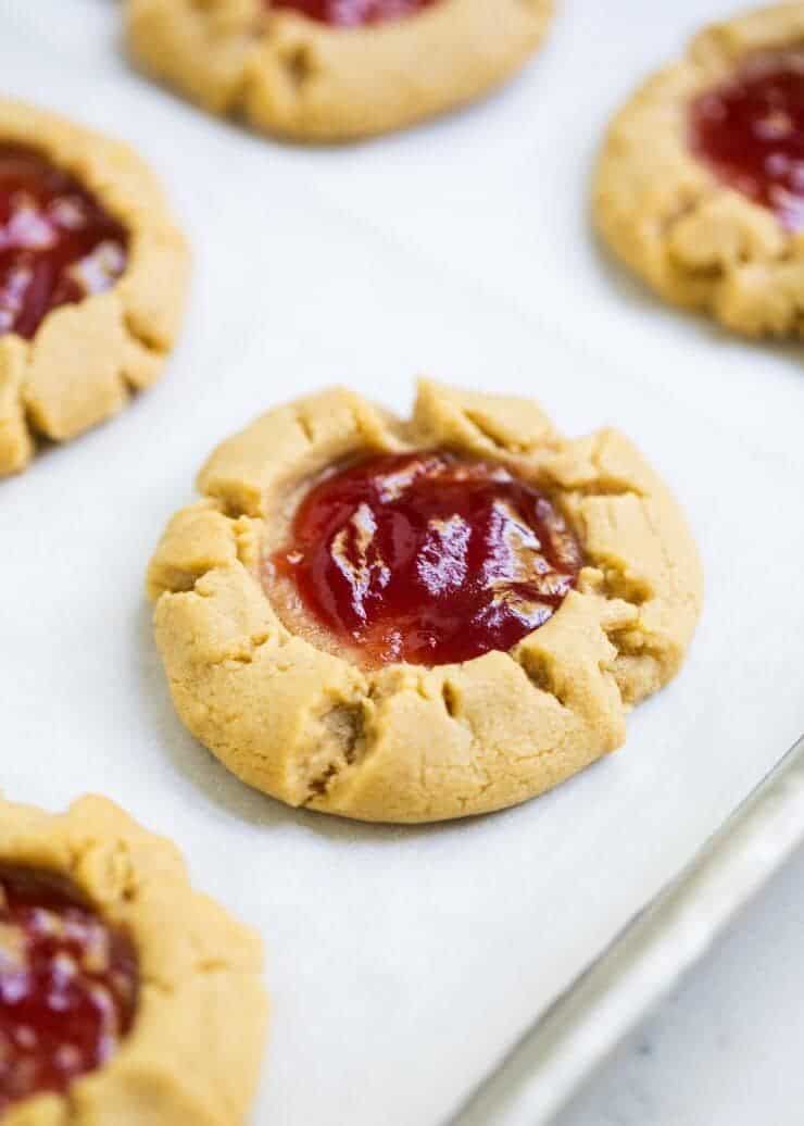 Peanut butter and jelly cookies on baking sheet