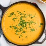 chorizo queso in a cast iron skillet