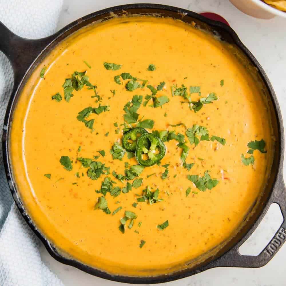 Chorizo queso dip in cast iron skillet. 