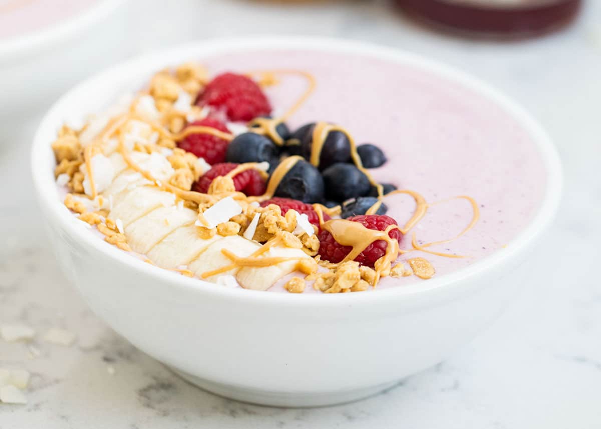 Berry smoothie in a white bowl.