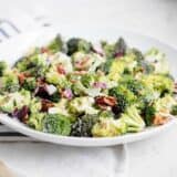 broccoli bacon salad in a shallow white bowl