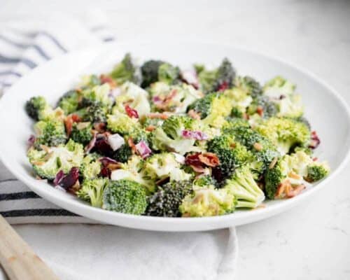 broccoli bacon salad in a shallow white bowl
