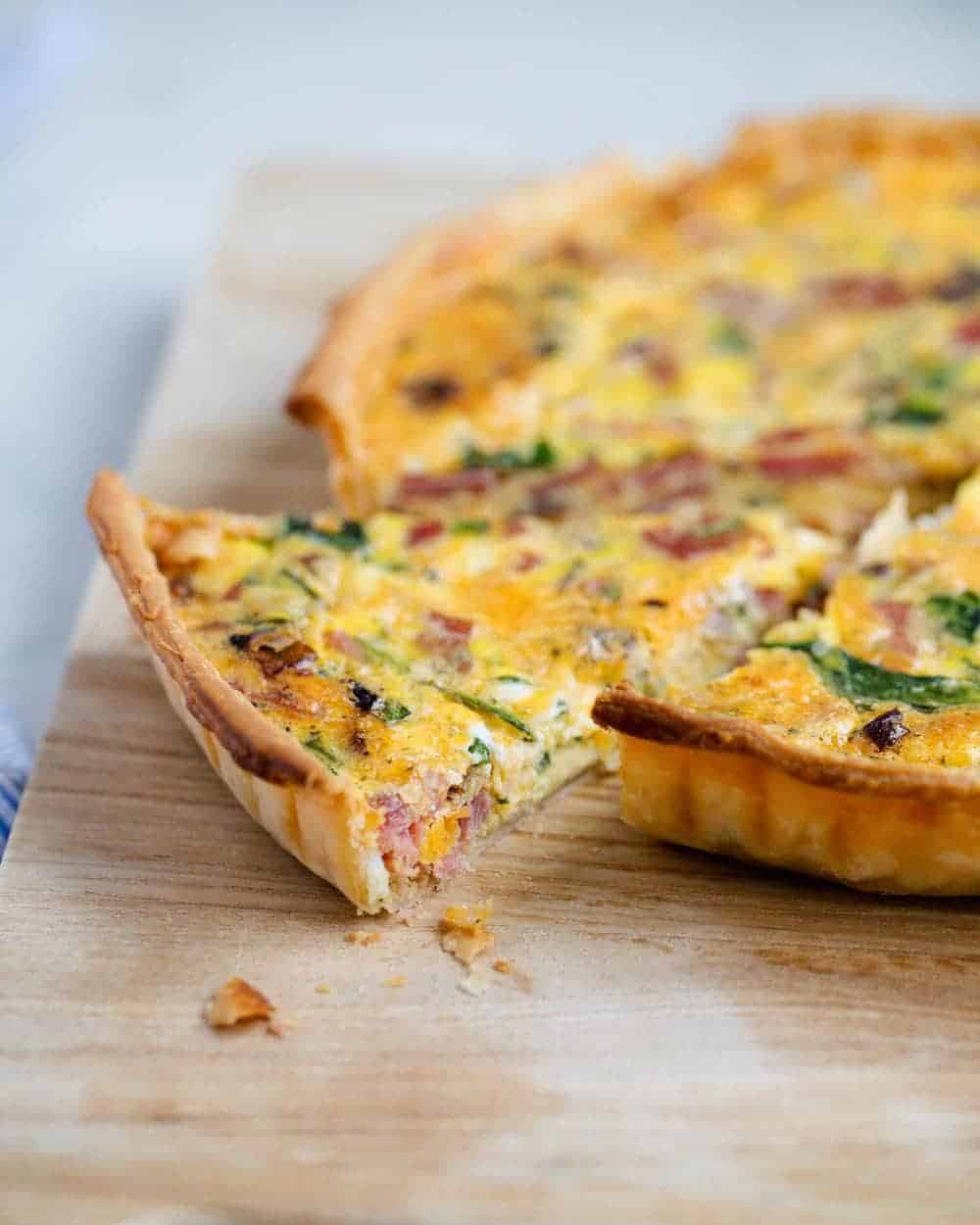 Slice of ham and cheese quiche.